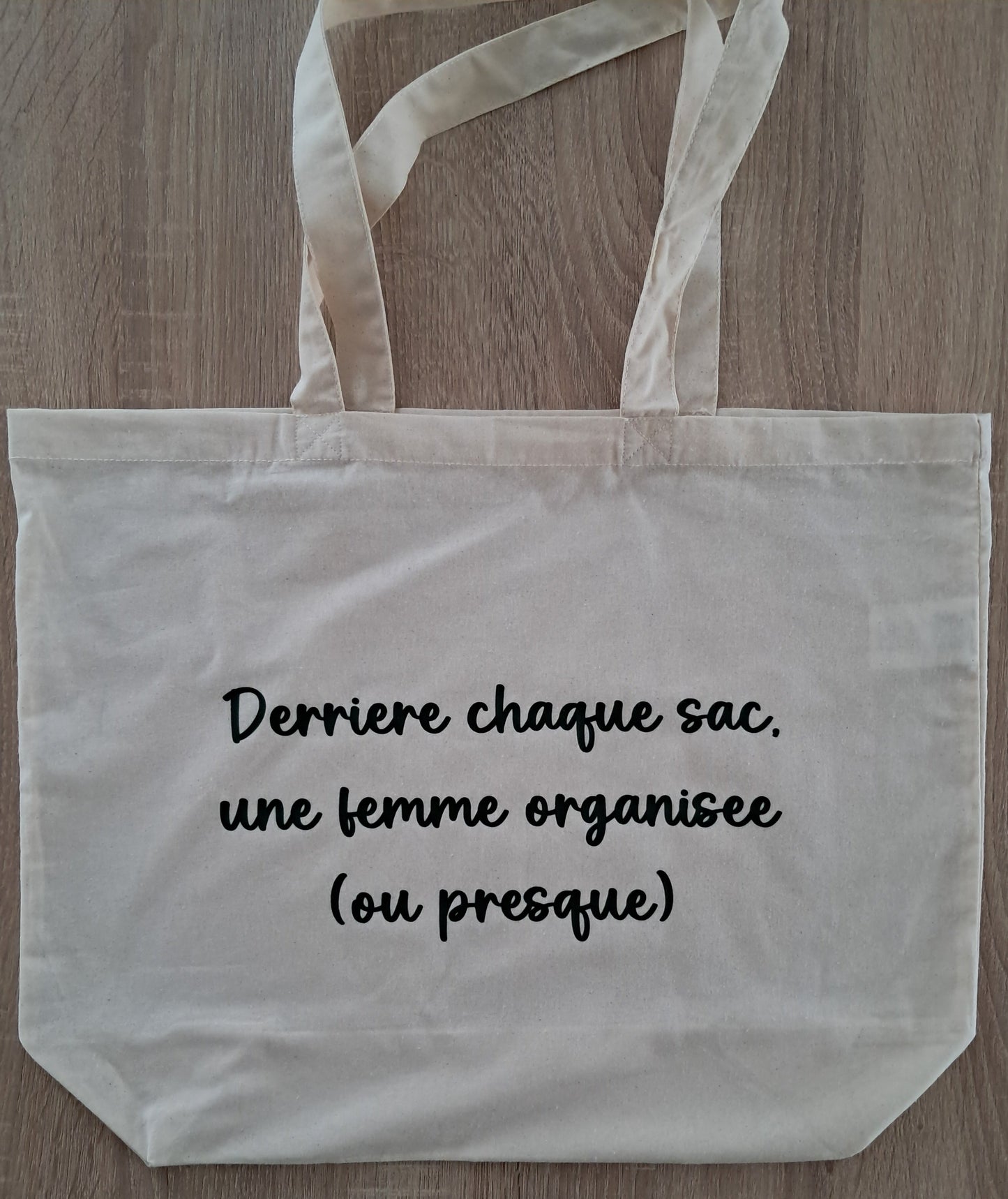 Grand sac de shopping "Derrière chaque sac, une femme organisée (ou presque)"